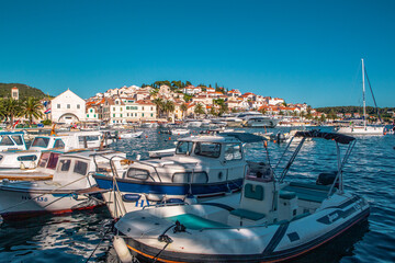 The old harbour at Hvar island, at the coast of Croatia, on a sunny day, summer time.