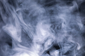 White cigarette smoke texture in a black background. 