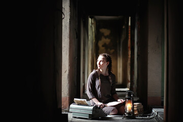 A girl with old books in the old house