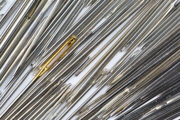 Many metal needles for sewing as background, texture, pattern.