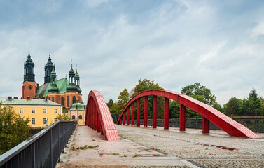 The Red Bridge to Tumskiy Island view in rainy day places to travel: Poznan / Poland - October 04, 2020