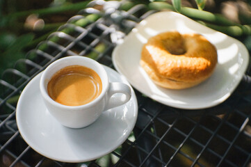 Coffee Espresso and Bagels on black table Natural Background