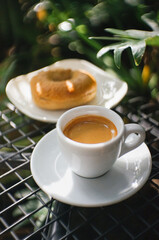 Coffee Espresso and Bagels on black table Natural Background