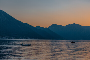 Sunset view of Kotor Bay in Montenegro,  with mountains and sea.