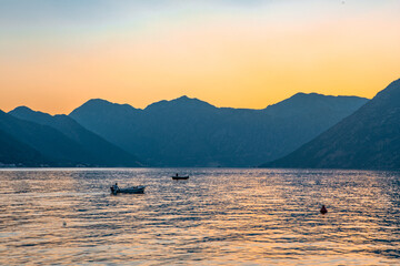 Sunset view of Kotor Bay in Montenegro,  with mountains and sea.