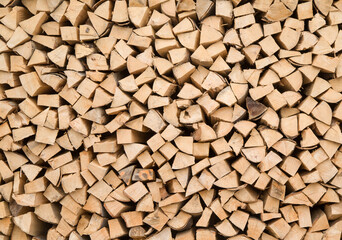 Composition of wood logs for texture, background. Natural wooden logs stacked Stocking up for winter. A pile of cut tree trunks