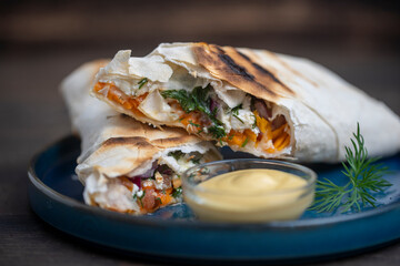 Burrito wraps with cottage cheese and vegetables in pita bread.