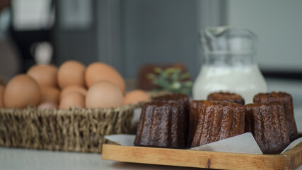 France sweet dessert, cannele de Bordeaux and milk, Zoom macro.