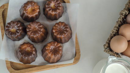 France sweet dessert, cannele de Bordeaux and milk, Zoom macro.