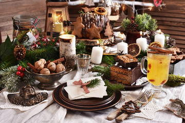 Christmas Eve wafer and pastries on festive table in rustic style