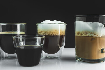 different types of coffee on a simple black white background