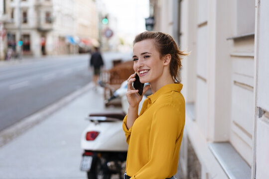 Young woman listening to a call on her mobile