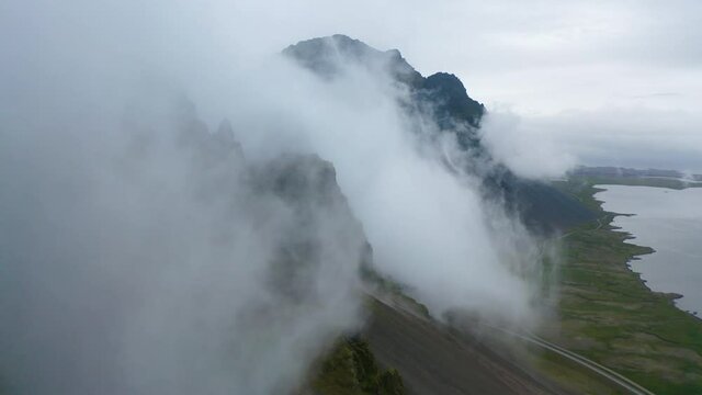 Aerial, pov, clouds moving over mountains, Iceland