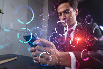 Man in office working with Smartphone, Searching for new tech. Abstract technology hologram, typing phone. Double exposure.