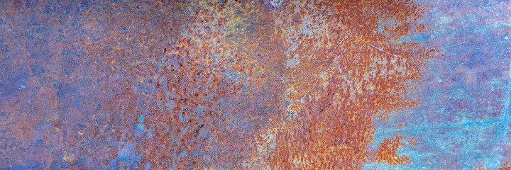 Background of rusty metal texture with traces of corrosion. Panorama.