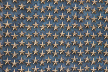 Metal stars on a blue metal background