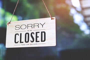 sorry closed sign on shop door. Text on cafe front or restaurant hang on door at entrance. vintage...
