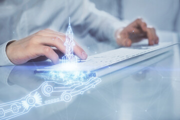 Start up drawings with businessman working on computer on background. Teamwork concept. Double...
