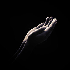 Ramadan kareem concept: Black and white muslim prayer open two empty hands with palms up on dark...