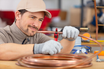 plumber soldering a copper pipe