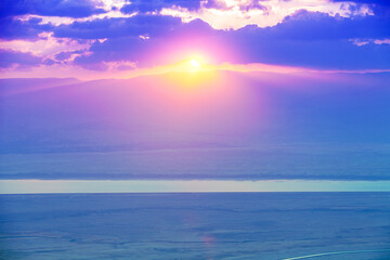 Naklejka na ściany i meble Beautiful purple sunrise over the Dead Sea. View from Masada fortress in Judaean Desert