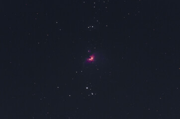  pink orion nebula in the starry night sky