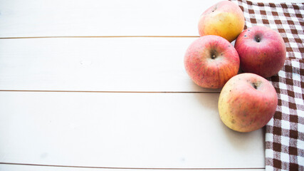 apples in a bag on a wooden background, free space for text