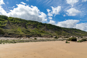 Villers-sur-mer, Normandy, France - Rocks on the beach at low tide near the 