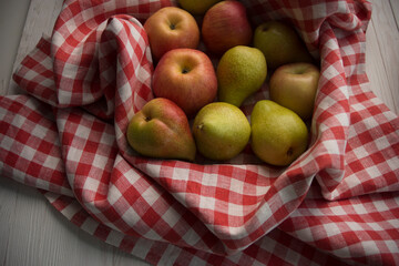 apples in a bag on a wooden background, free space for text