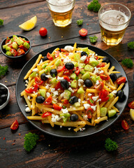 Loaded potato Vegan Fries with tomato, cucumber, olives and feta cheese