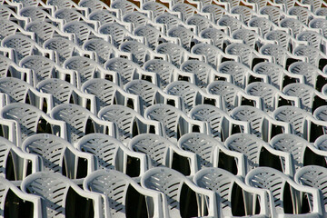Plastic chairs arranged in rows for audience of an event
