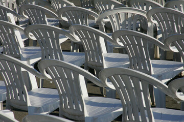 Plastic chairs arranged in rows for audience of an event
