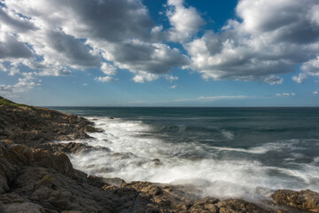 Fototapeta na wymiar Waves washing onto rocks at Losari in Corsica