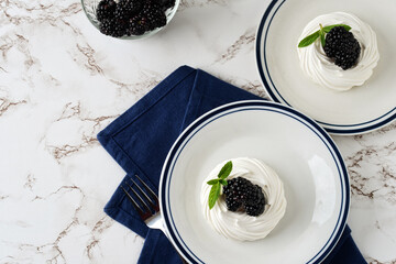 high angle view blackberries with meringue and mint