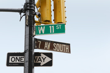 Street signs on the corner of 7th Ave South and West 11th Street, New York City