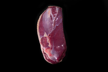 Duck breast, on black background	