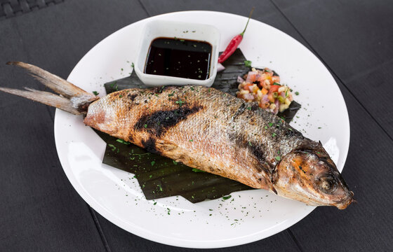 Grilled Boneless Bangus stuffed with vegetables and served with soysauce and Atchara. Bangus is also known as Milkfish.