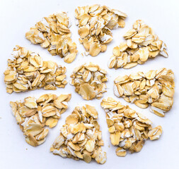 Oatmeal on a white background. Oatmeal grits.