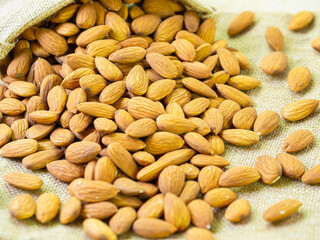 Almond (raw) laying on bag.