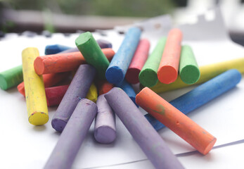 chalks in a variety of colors arranged on a white background