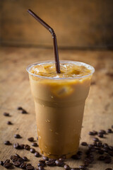 ice coffee in glass on wooden table