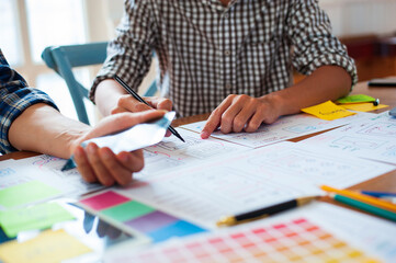 The designers outline the user interface for websites and mobile apps.