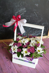 Crysanthemum flowers in a wooden basket
