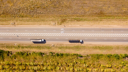 top view of the road in the wilderness. a truck delivers cargo across the desert. drone photo © Сергей Теребов