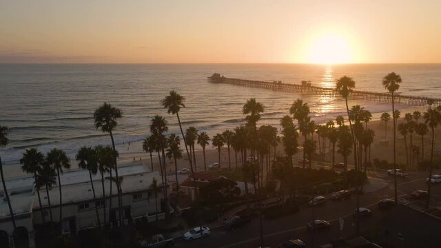Drone moving parallel to the beach in Oceanside Southern California