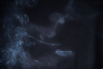 Smoke in motion on dark background	