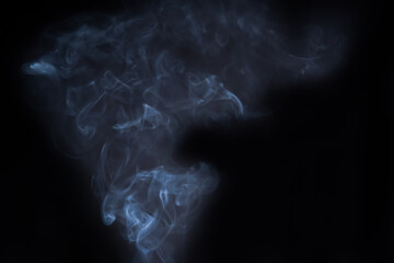 Smoke in motion on dark background	