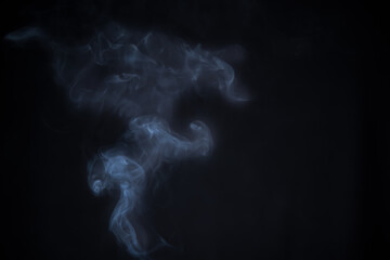 Smoke in motion on dark background	