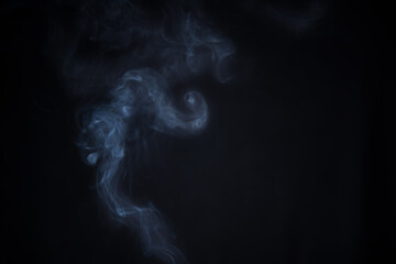 Smoke in motion on dark background	