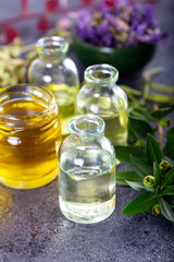 Obraz na płótnie Canvas Bottles of essential oils for aromatherapy treatment.